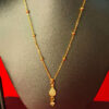 Yellow gold chain pendant with a sleek and elegant design for women.