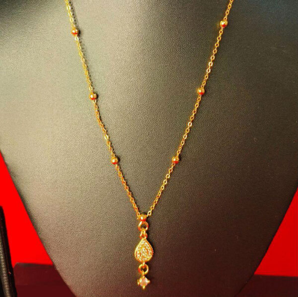 Yellow gold chain pendant with a sleek and elegant design for women.