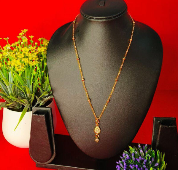 Yellow gold chain pendant with a sleek and elegant design for women.