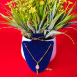 Yellow gold chain pendant with a sleek and elegant design for women.